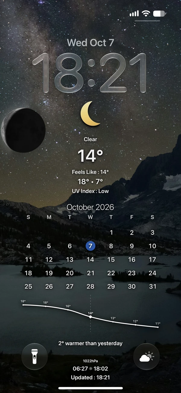 A starry mountain landscape with moon and weather on an iPhone lock screen
